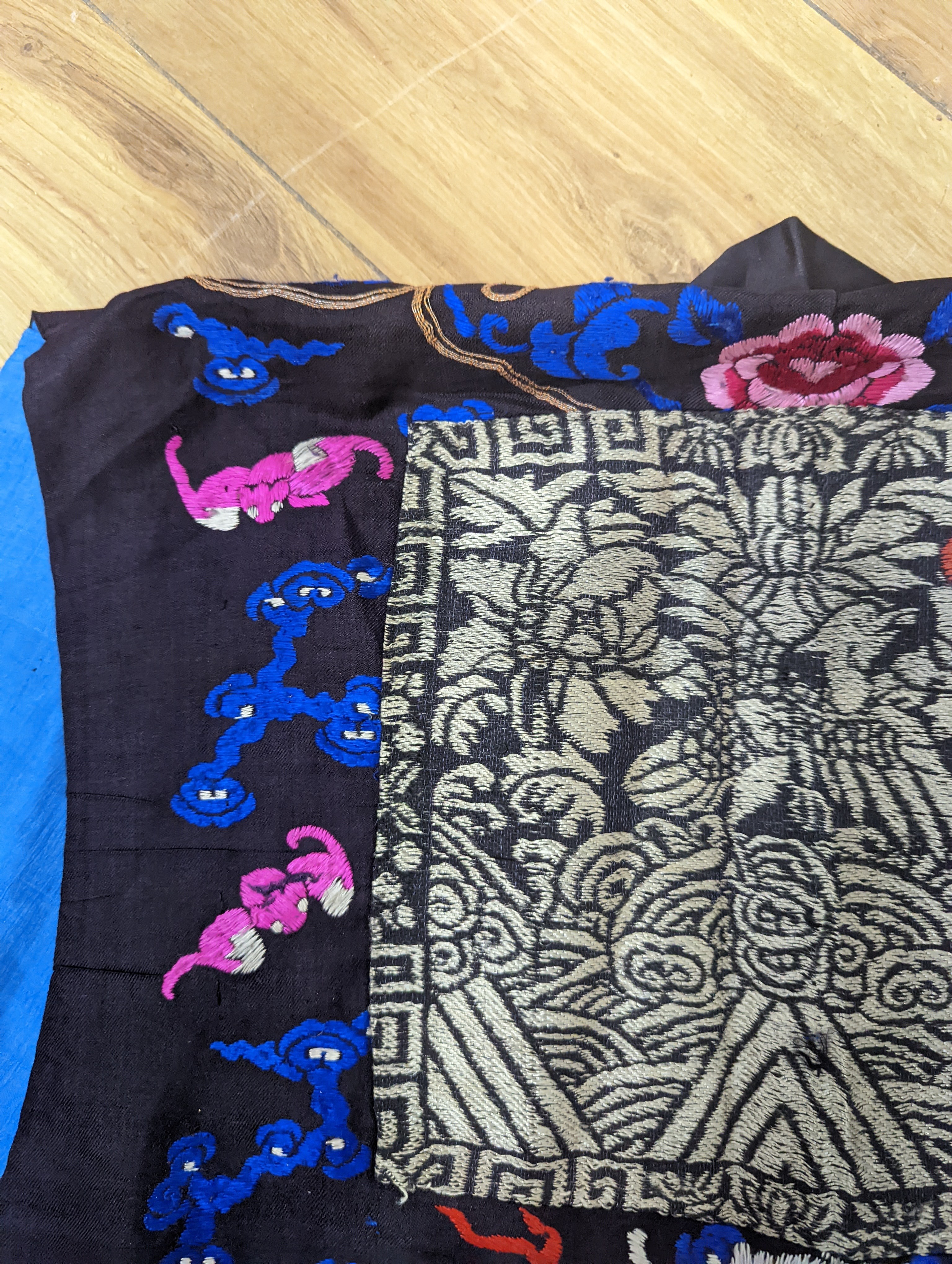 A 1920's Chinese dragon embroidered waistcoat, a cream silk drawn thread dress and a silk crepe black and patterned reversible kimono (3 items).